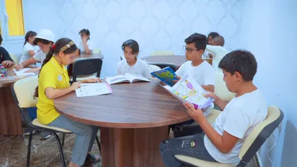 Horizontal video: Children reading books in class wide shot 20339989. Duration: 15 seconds. Resolution: 1920x1080
