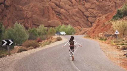 Horizontal video: Woman walking in the middle of the road 3018669. Duration: 24 seconds. Resolution: 1920x1080